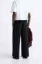 Trousers with contrast double waist