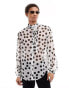 Фото #1 товара ASOS DESIGN relaxed polka dot shirt with tie neck in white and black