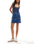 Фото #1 товара Tommy Jeans seam detail mini skirt in mid wash