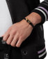 ფოტო #3 პროდუქტის Gold-Tone IP Stainless Steel 3D $kull & Logo Leather Flex Bracelet