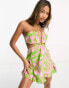 ASOS DESIGN halter mini beach dress with cut out waist in smudge print