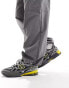 New Balance 1906 trainers in dark grey and yellow