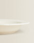 Earthenware soup plate with raised-design edge