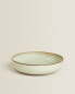 Porcelain soup plate with antique finish rim