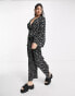 Wednesday's Girl v-neck wide leg long sleeve jumpsuit in black daisy