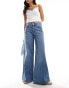 Фото #1 товара Vero Moda extreme wide leg jeans in medium blue wash