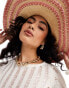 Accessorize wide brim summer hat with pink stitching in natural