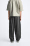 WIDE-FIT PLEATED TROUSERS