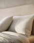 Rounded headboard with linen cover