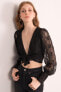 Фото #12 товара Женская блузка с длинным ажурным рукавом и завязанным бюстье - черная Factory Price