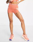 Фото #4 товара Nike Pro Training Seasonal Dri-FIT high rise 3 inch booty shorts in pink