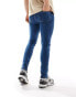 ASOS DESIGN skinny jeans in mid blue