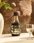 Glass bottle with rattan stopper