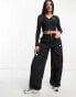 Фото #1 товара Nike Dance woven multi pocket cargo trousers in black