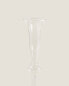 Raised design glass candlestick