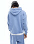 ASOS DESIGN unisex co-ord oversized hoodie with raw hem in washed denim blue