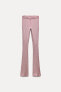 FADED-EFFECT RIBBED FLARED TROUSERS