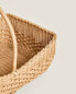 Woven rattan basket with handle