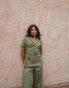Фото #8 товара Labelrail x Pose and Repeat belted boiler suit in forest green with pink contrast stitch