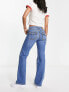 Фото #5 товара Levi's noughities boot cut distressed jeans in mid wash blue