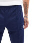 adidas Originals Beckenbauer tracksuit bottoms in indigo