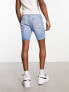 ASOS DESIGN classic rigid regular length denim shorts in light wash blue with rip