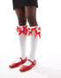 Reclaimed Vintage knee high socks with red bows in white