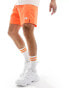 The North Face 24/7 5" logo shorts in orange