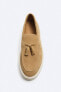 Split leather loafers with tassels