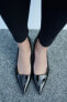 Shiny heeled shoes