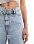 ASOS DESIGN denim mini skirt with cross front waist in light wash