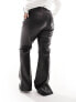 Vero Moda Curve leather look flared trousers in black