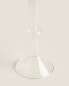 Raised design glass candlestick