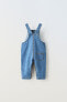 Denim dungarees with pocket