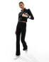 Fashionkilla ribbed zip through contrast bow detail jumper in black