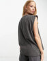 ASOS DESIGN washed oversized tank with drop arm hole with lost tour rock graphic in washed charcoal