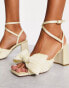 Фото #1 товара ASOS DESIGN Hitched bow detail mid block heeled sandals in ivory