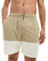 ASOS DESIGN swim shorts in mid length in khaki block print