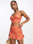 ASOS DESIGN co-ord flippy skirt with side ruching in orange red floral