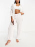 The Frolic tourmaline shirred wide long trouser co-ord in white pleated texture