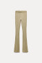 FADED-EFFECT RIBBED FLARED TROUSERS