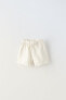 Plush bermuda shorts with bow and ruffles