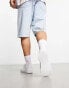 Truffle Collection lace up plimsolls in white