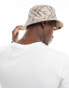 Karl Kani signature reversible bucket hat in beige paisley