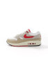 Nike Air Max 1 SC trainers in white, navy and gold