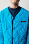 Padded jacket with trims