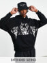 ASOS DESIGN oversized hoodie in black with tiger print