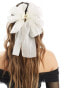 True Decadence bow hair claw in white