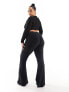 ASOS DESIGN Curve rib flare trouser with lettuce hem in black