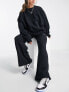 Фото #7 товара Nike mini swoosh high rise wide leg joggers in black and sail